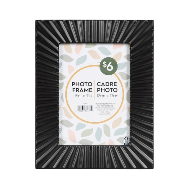DesignOvation Sunni 5x7 Black Picture Frame with a dimensional sunburst pattern in black, designed to hold a 5 by 7 inch photo. It includes an easel for tabletop use and a wall hanger, suitable for home décor or gallery wall displays.