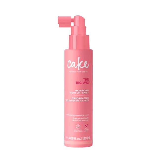 Cake Beauty The Big Wig Hair Raiser Root Lift Spray in a pink 120 mL bottle with angled spray nozzle, providing 2x volume and 72-hour root lift with a touchable, brushable finish. It features a delicate lemon cookie scent and a vegan, cruelty-free formula, ideal for volumizing limp hair.