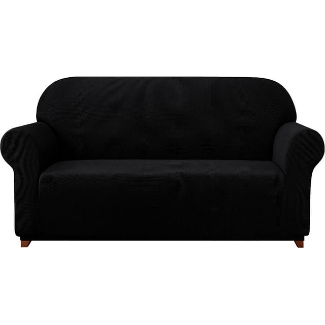 Subrtex Housse de Canapé Extensible 1 Pce Slipcover Antidérapante avec Motif à Carreaux Texturé de Couleur Noire Unie. la Slipcover Est Conçue pour s'Adapter Parfaitement avec des Coins Élastiques Intégrés, Offrant un Ajustement Semi-Personnalisé pour les sofas. Fabriquée à Partir de 85 % polyester et 15 % Élasthanne, Elle Est Douce, Respirante et durable. Convient pour Protéger les Meubles contre l'Usure Quotidienne, les Déversements et les Taches. Idéale pour les Maisons avec des Enfants Ou des Animaux de Compagnie. Affichée sur un Sofa standard dans une Vue Orient