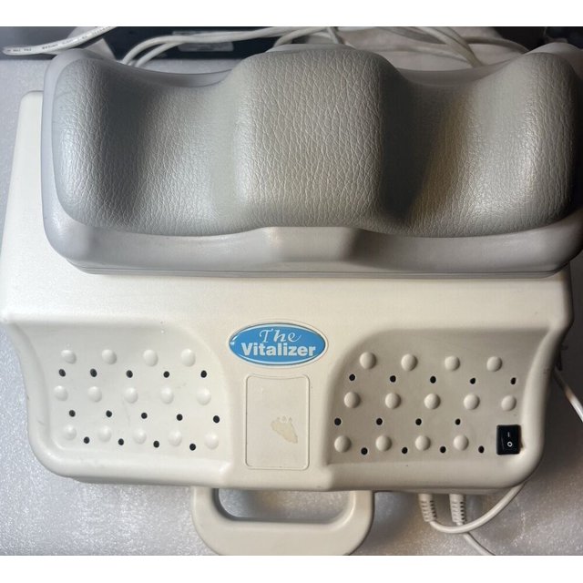Chi Vitalizer Energizer CY-106 Swing Massager Chi Machine with one-speed functionality, designed for therapeutic back and leg massage. Features include a white plastic body, textured gray cushioning, ventilation holes, a handle, and a power switch for ease of use.