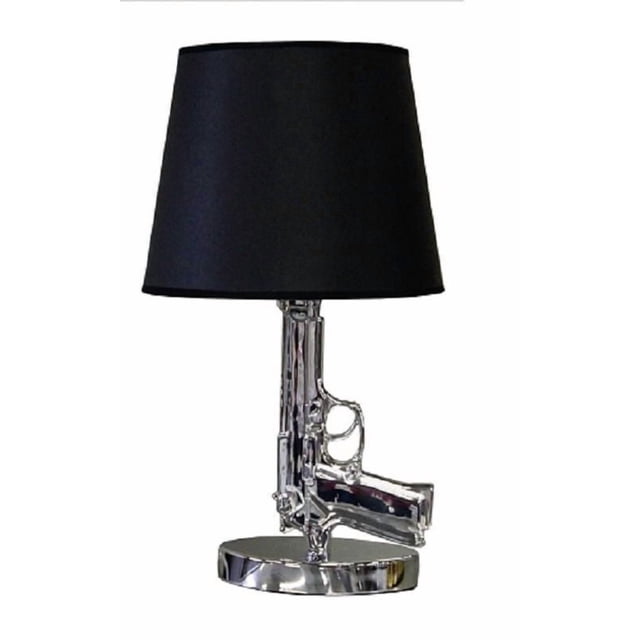 SMALL GUN TABLE LAMP with a chrome metal base shaped like a handgun and a black tapered fabric lampshade, measuring 16.8 inches high and 9.3 inches wide, suitable for modern home lighting and accent décor.