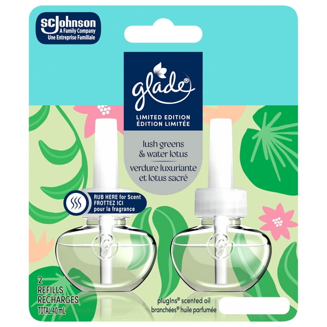 Glade PlugIns® Air Freshener Oil Refill, Lush Greens & Water Lotus, showing two clear glass scented oil refill bottles with white caps on a green leafy and floral patterned backing card, labeled limited edition with bilingual English and French text, ideal for refreshing indoor air.