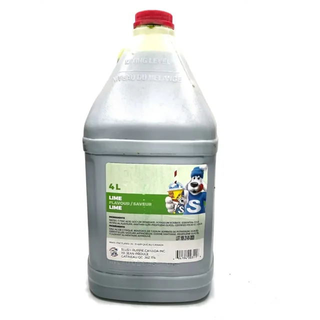 Slush Puppie Lime Slushy Syrup 5:1 Concentrate in a 135 oz (4L) container. The front-facing view shows a large gray plastic jug with a red resealable cap and a green label featuring the Slush Puppie mascot holding a lime slushy. The label highlights the lime flavor and mixing instructions, with text in both English and French. Suitable for frozen slushy and granita machines, this syrup offers a sweet lemon-lime flavor and high yield for beverage preparation.