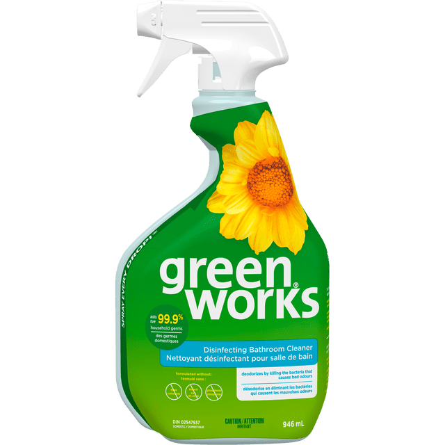Green Works™ Disinfecting Bathroom Cleaner 946mL spray bottle with white trigger nozzle and green label featuring a large yellow sunflower, kills 99.9% of household germs and deodorizes by eliminating bacteria that cause bad odours, formulated without dyes, bleach, or phosphates, suitable for cleaning bathroom surfaces.