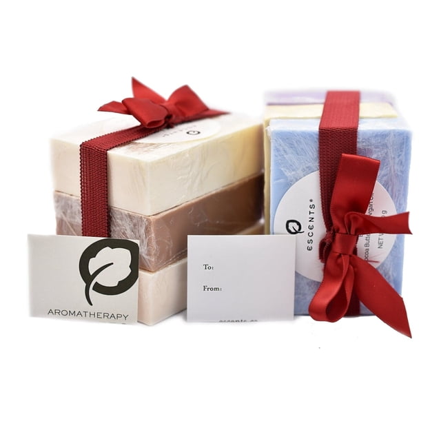 Escents Soap Trio - Breeze, Lavender, Rejuvenating. A set of three bar soaps in white, beige, and light blue, each wrapped in clear packaging and tied with a red ribbon. Includes a gift tag and aromatherapy branding, ideal for gifting.