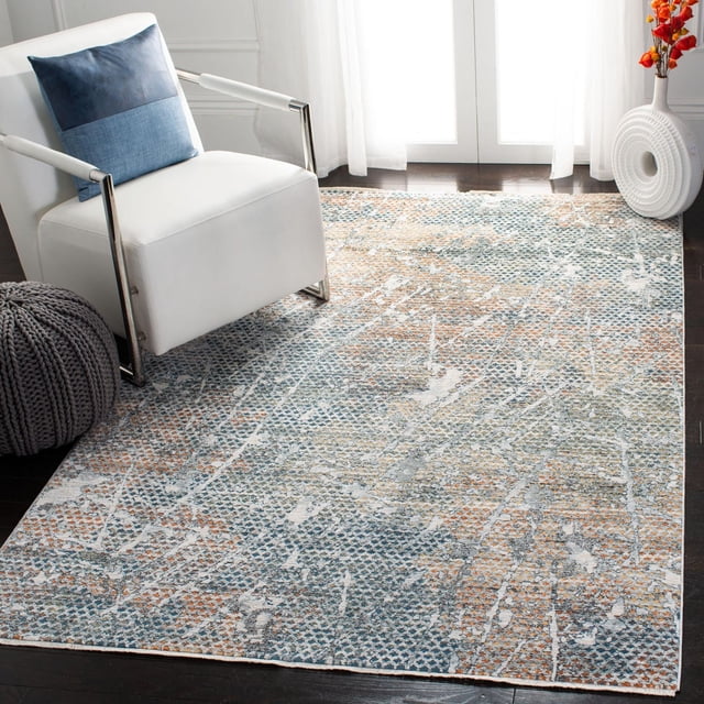 SAFAVIEH Winston Florence Tapis Surteint avec Motif Abstrait Bleu, orange et beige Atténué sur Plancher de Bois Franc Foncé, Montré dans une Pièce Moderne avec un Fauteuil Blanc avec Accoudoirs Chromés et Coussin Bleu, pouf Tricoté Gris, et vase sculptural Blanc avec Fleurs orange par des Rideaux Transparents. les Fils Synthétiques Doux du Tapis Offrent une texture Souple et Il Est Souvent Utilisé pour Rehausser des accents Contemporains pour la Maison.