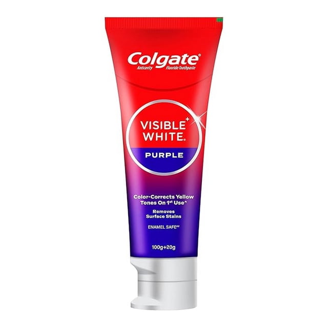 Colgate Visible White Purple Fluoride Toothpaste in a 100g + 20g tube. The toothpaste is formulated to remove surface stains, whiten yellow teeth, and is safe for daily use. The packaging features a red-to-purple gradient design with the Colgate logo at the top and product details clearly displayed.