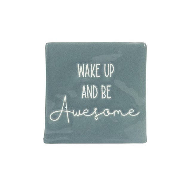 Linden “Wake Up and Be Awesome” Porcelain Tabletop Square Art Plaque with a front-facing blue porcelain block measuring 4.1 by 4 inches featuring white text 'Wake Up and Be Awesome,' designed as inspirational tabletop décor ideal for home, office, or apartment shelves, also suitable for adding motivational style to small spaces.