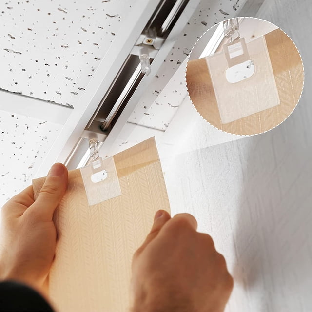 16 Set/32 Pieces Clear Vertical Blind Repair Tabs used to fix damaged vertical blind slats. The transparent tabs feature pre-cut precision holes and strong adhesive for secure attachment, blending seamlessly with the blind's texture. Ideal for window treatments and blind accessories.