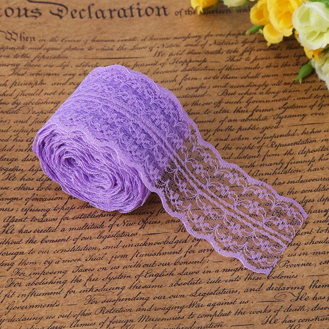 Rdeghly 10 m/roll 4.5CM width lace ribbon in purple, made of polyester silk with a delicate machine-woven lace design. The ribbon is displayed rolled on a decorative background, showcasing its intricate scalloped edges and layered texture. Ideal for DIY crafts, wedding decorations, clothing embellishments, and hair accessories. Packaged in a 10-meter roll with OPP independent packaging.