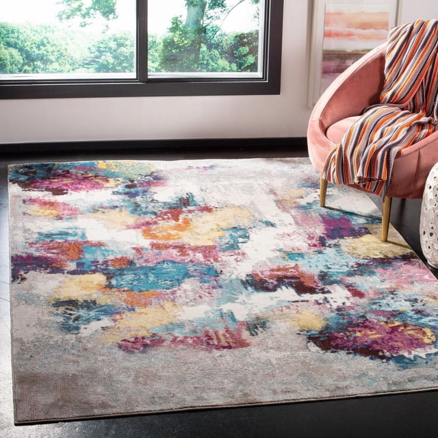 SAFAVIEH Aria Creighton Tapis Abstrait avec Motif Abstrait Vieilli en Bleu Vif, Violet, Jaune et orange sur Fond Neutre Clair, Tissé Mécaniquement à Partir de Fils Synthétiques pour la Durabilité, Exposé sur un Plancher Sombre Près d'Une Chaise en Velours Rose avec un Jeté Rayé dans une Pièce Ensoleillée, Convient aux Zones à Fort Passage.