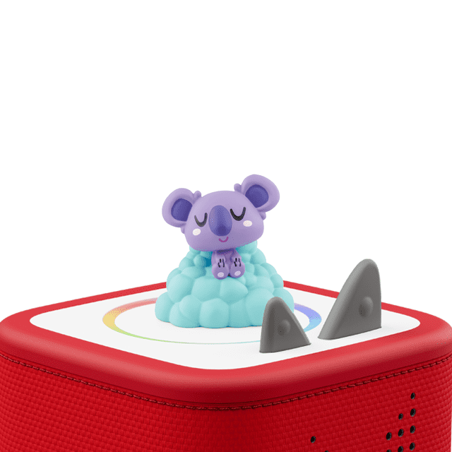 tonies Moshi: Sleepypaws Audio Play Figurine showing a purple koala character with closed eyes sitting on a light blue cloud base, placed on a red Toniebox speaker with a white top and multicolour circular design, suitable for screen-free educational play.