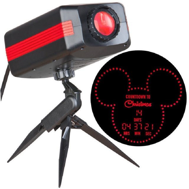 Disney Magic Holiday Mickey Mouse Countdown Lightshow Projector Light featuring a black and red projector with a convertible tripod stake. The projector displays a Mickey Mouse-shaped countdown to Christmas with days, hours, minutes, and seconds in red LED lights. Projects onto walls or flat surfaces up to 8 feet away and includes a 6-foot cord.