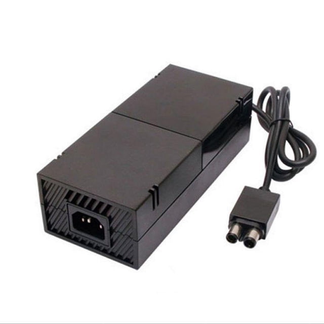 Xbox One Power Supply Brick Adapter Power Supply Charger in a black rectangular design with a built-in LED indicator light. Features an AC input voltage of 100-240V and DC output of 12V and 5V, providing 200W high power for rapid charging. Includes a connected power cord for convenient use with Xbox One consoles.