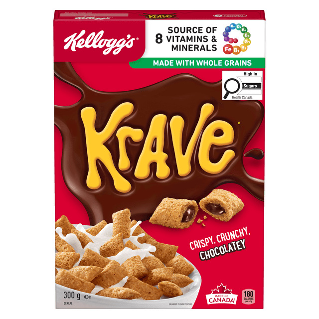 Kellogg's Krave* Cereal, 300g box with red background featuring the yellow Krave logo over a chocolate splash, displaying crispy whole grain cereal pillows filled with chocolate and a bowl of cereal with milk, labeled as a source of 8 vitamins and minerals, made with whole grains, high in sugars, and made in Canada.