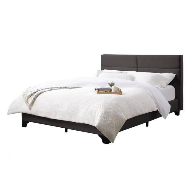 CorLiving Bellevue Upholstered Adult Queen Platform Bed Frame with Slats and Wide-Rectangle Panel Headboard in dark fabric upholstery, featuring a wide padded headboard with clean seams, black solid wood legs, and 14 durable wooden slats with adjustable center support legs for stability, designed to fit a standard queen mattress without a box spring, shown with white bedding and a wooden tray.