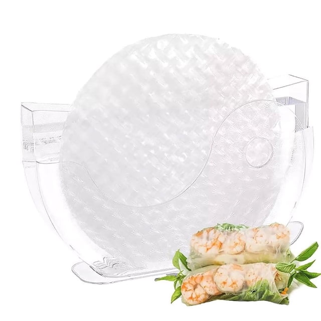 WRXMIJNHGSA Food Storage Under $10 Rice Paper Water Bowl made of transparent plastic, designed for household supplies and disposable tableware. Features a side pocket for rice paper storage and two sections: one for spring roll wrappers and another for water dipping. Compact and sturdy with a rectangular base, ideal for clean and mess-free preparation of spring rolls. Shown with rice paper and spring rolls for context.