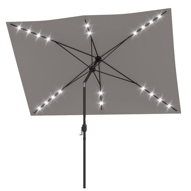 Outsunny 6.5' x 10' patio umbrella in light grey with solar-powered LED lights. Features a rectangular polyester canopy supported by a dark brown aluminum pole with six steel ribs. The umbrella includes 20 white LED lights, a crank handle for easy opening, and a tilt function for adjustable shade. Designed for outdoor use in patios, gardens, or poolside areas. Umbrella base not included.