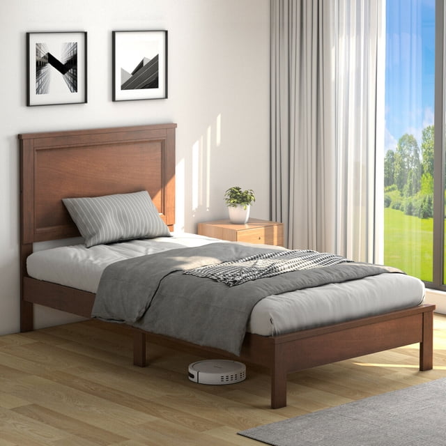 Gymax Twin Size Bed Frame Platform Slat with high headboard and rubber wood legs in a walnut finish. The bed features a sturdy construction with solid rubber wood legs and extra support legs for enhanced stability. It includes pre-connected wooden slats that eliminate the need for a box spring, suitable for a standard twin-size mattress. The integrated headboard adds style and comfort, while the 5.5-inch under-bed space allows for storage or cleaning. Displayed in a modern bedroom setting with natural light and minimalist decor.