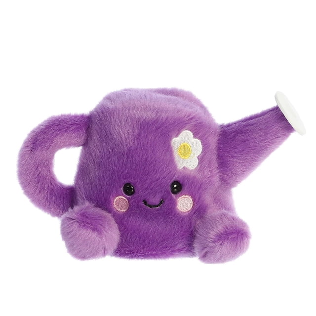 Aurora Palm Pals - Flo Watering Can 5-inch plush toy, shaped like a purple watering can with a soft, fluffy texture. Features embroidered facial details, pink cheeks, and a white flower accent. Made with bean pellets for stability, ideal as a stuffed animal or plush toy for all ages.