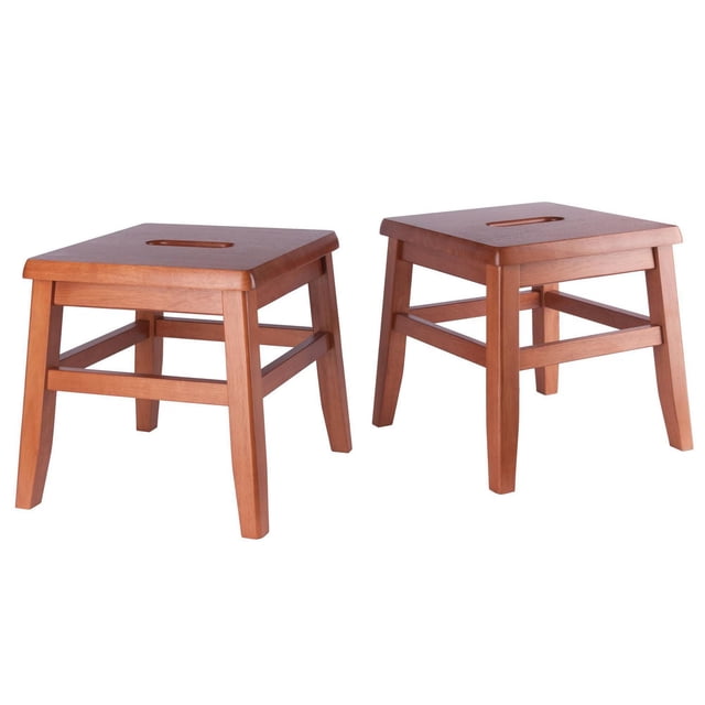 Winsome Kaya 2-pc Set Conductor stool Teak Finish with two solid wood square stools featuring a natural teak finish, cut-out handles on the seats for easy transport, and sturdy legs connected by four crossbars for stability, each measuring 12 inches high, wide, and deep, ideal for kitchen or dining seating and suitable as a small step stool for reaching high shelves.