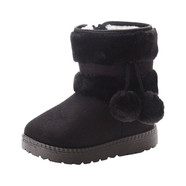 TIMIFIS Kids Snow Boots Warm Inside Boys Girls Boots Cold Weather Non Slip Winter Boot With Side Zipper - Spring. A single black toddler snow boot with a flat sole, soft synthetic leather upper, and a warm, plush interior. Features a side zipper for easy wear and decorative pom-poms on the cuff. Designed for boys and girls, suitable for cold weather and outdoor activities.
