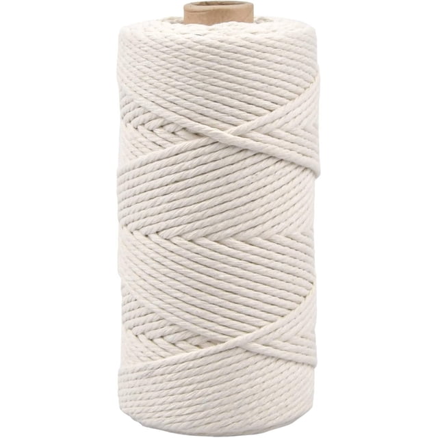 Softness and Density Macrame Cord Rope by Dutchman, shown as a tightly wound spool of off-white cord. Ideal for craft twine string projects and home decor applications, this ethically manufactured cord is designed for DIY enthusiasts.