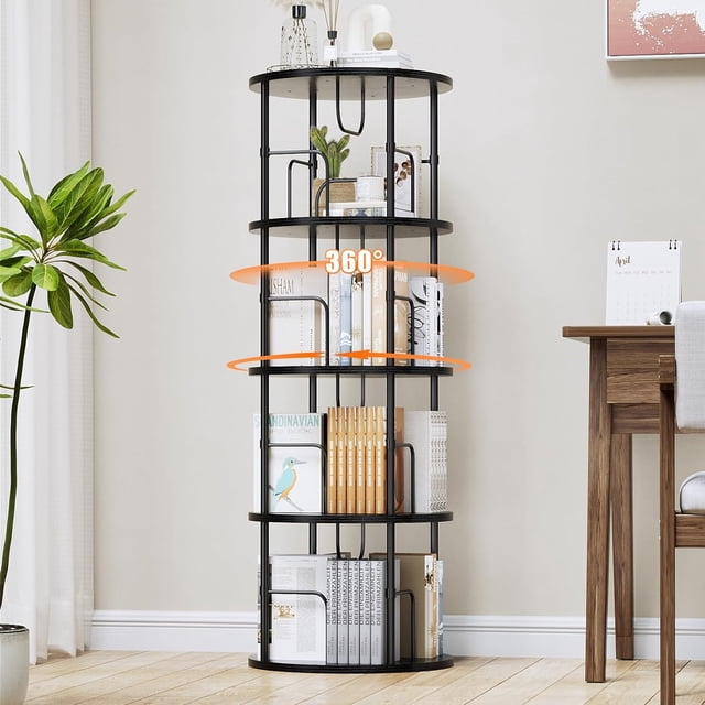 Flycity 4 Tier Rotating Bookshelf in black, designed for space-saving and organized storage. This 360° rotating bookcase features visible partition storage and four tiers, each divided into compartments to prevent books from tipping over. Made of engineered wood and metal, it is ideal for office furniture or home use. Displayed in a modern room setting next to a desk and plant.