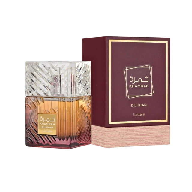 Lattafa Khamrah Dukhan unisex perfume displayed with its elegant packaging. The perfume bottle features a textured glass design with amber and gold tones, paired with a matching maroon and gold box. Suitable for both men and women, this fragrance is part of the Lattafa brand's collection.