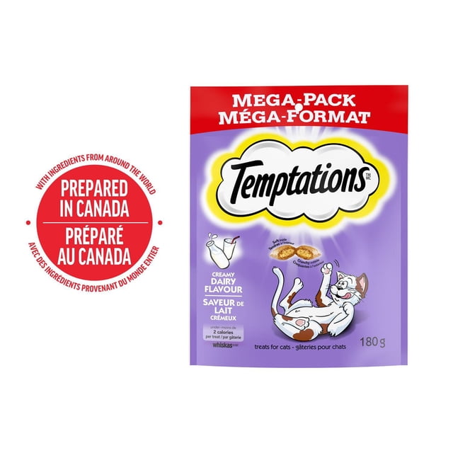 Temptations Creamy Dairy Flavour Soft & Crunchy Adult Cat Treats 180g mega-pack pouch with purple and red packaging, featuring crunchy outside and soft inside treats and a playful white and brown cartoon cat, prepared in Canada and suitable for daily adult cat rewards.