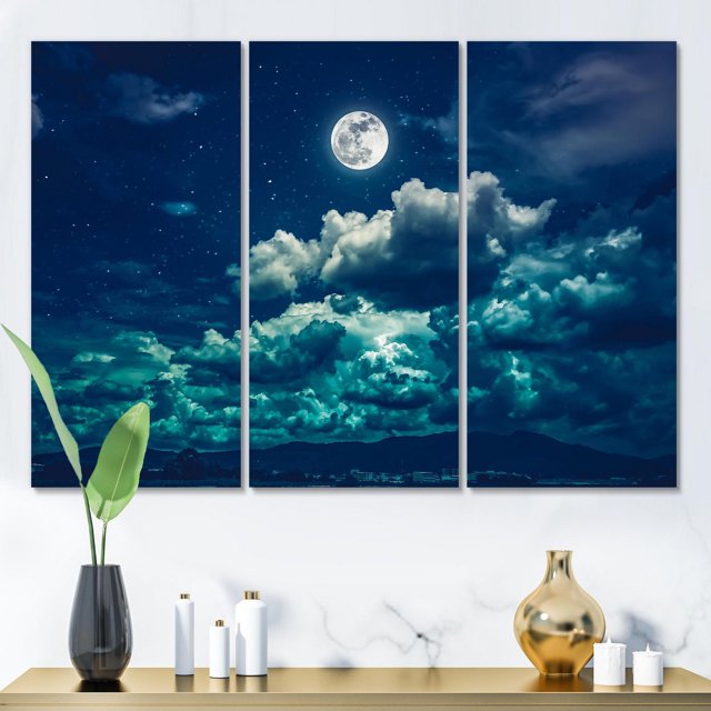 Designart Full Moon In Cloudy Night Sky II Canvas Wall Art triptych depicting a bright full moon above layered blue and white clouds in a starry night sky, printed on premium cotton canvas with gallery-wrapped edges, ready to hang and ideal for nautical and coastal home décor.