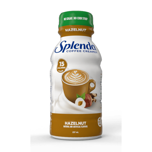 Splenda Sugar Free Hazelnut Coffee Creamer 236mL bottle with green cap and brown label, featuring a brown coffee cup with latte art, highlighting zero sugar, zero corn syrup, 15 calories per serving, and keto-friendly non-dairy creamer with natural and artificial flavours, suitable for adding rich flavour to coffee.