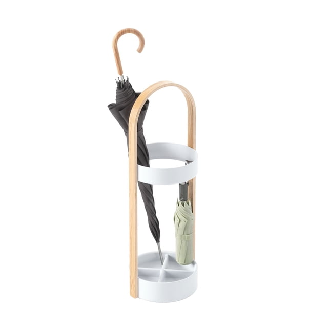 BELLWOOD Umbrella Stand White/Natural with a round white resin base and upper ring, curved natural wood veneer handle, holding one tall black umbrella and one compact light green umbrella. The water-resistant, rust-proof stand measures 8 ¾ inches diameter by 27 inches tall and fits multiple spaces.