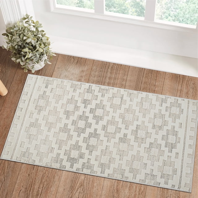 Modern beige and cream Rug Branch Astra indoor area rug with abstract geometric design displayed on wooden floor by a window, suitable for living room, bedroom, dining room, or kitchen.