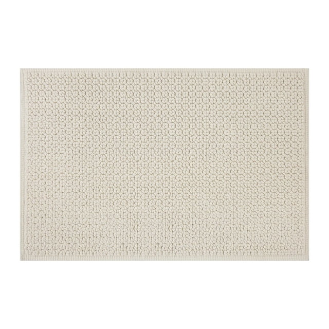 Better Homes & Gardens Signature Soft Looped Bath Mat, Vanilla Dream, 20" x 34", rectangular bath rug with soft looped 100% cotton texture in creamy vanilla and stitched border, designed for bathroom absorbency and decor, also suitable as a non-slip mat with rug pad on wood floors.