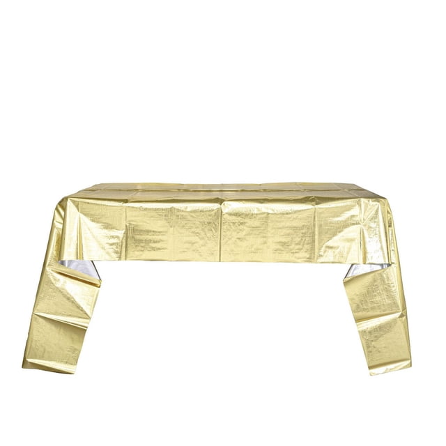 Metallic disposable table cover in gold, sized 96 by 52 inches, shown draped over a rectangular table with visible folds and a reflective metallic finish, suitable for party use and easy cleanup after events.
