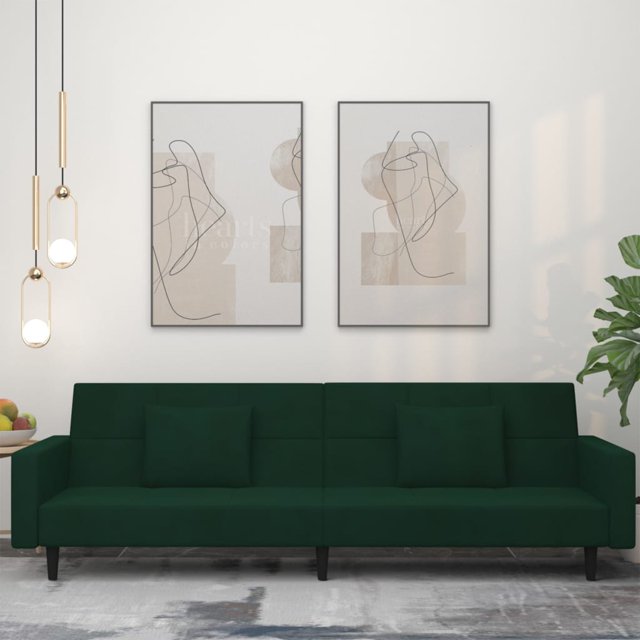 vidaXL 2-Seater Sofa Bed with Two Pillows in dark green velvet, shown in a modern living room setting. The sofa features a sleek design with a wooden frame, foam filling, and velvet upholstery. It includes two matching square pillows and can be easily converted into a bed. Dimensions as a sofa are 220 x 84.5 x 69 cm, and as a bed are 220 x 100 x 52 cm. Suitable for living rooms, home theatres, or small spaces.