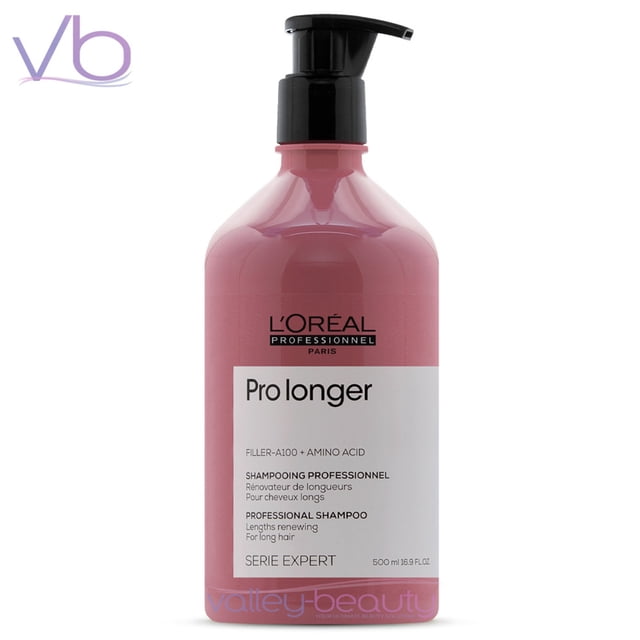 L’Oreal Professionnel Serie Expert Pro Longer Shampoo in a 500ml bottle with a pump dispenser. The pink bottle features branding and product details, including 'Filler A-100 + Amino Acid' and 'Professional Shampoo for long hair.' Designed to renew hair lengths, reduce breakage, and add shine, it is recommended for long hair with thinned ends.