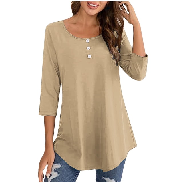 FAIWAD Oversized Tshirts for Women featuring a 3/4 sleeve design with button decor on the front. This round neck top in a solid beige colour offers a relaxed fit, making it suitable for casual and business settings. The lightweight and breathable polyester material ensures comfort and durability. Styled with distressed jeans, this blouse is ideal for pairing with various bottoms and layering options for versatile looks.