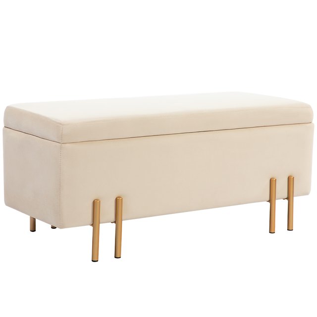 HOMCOM Storage Ottoman Bench, Flip-Top Bedroom Bench, 18.5 Gallons, Beige. A rectangular storage bench upholstered in beige velvet-feel fabric, featuring electroplated gold metal legs and a flip-top lid with curved handles. Offers 18.5 gallons of storage space, ideal for organizing clutter in living rooms, entryways, or bedrooms. Functional furniture with a compact design.