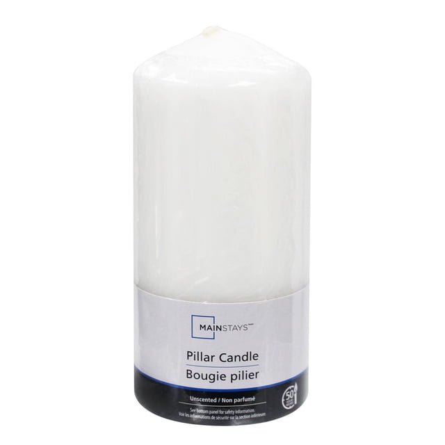 Mainstays Unscented 6 inch white pillar candle with smooth wax and cotton wick, shown upright with label, suitable for indoor Christmas decorations and providing warm ambient lighting for holiday settings.