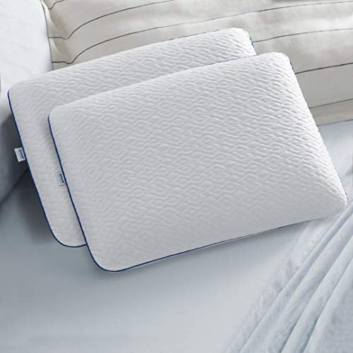 Sleep Innovations Forever Cool Gel Memory Foam Pillow in standard size, shown in white. The pillow features a textured cool-to-touch cover with woven cooling fibers for immediate relief. Designed with gel memory foam for responsive support and enhanced cooling comfort, it is displayed on a neatly made bed with light bedding.