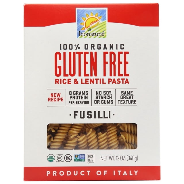 Bionaturae Organic Gluten-Free Rice & Lentil Pasta Fusilli in a 12 oz. (340 g) box. The packaging features a red and white design with the Bionaturae logo at the top, highlighting its organic and gluten-free qualities. The box includes details such as 8 grams of protein per serving, no soy, starch, or gums, and a claim of great texture. A transparent window displays the spiral-shaped fusilli pasta inside. Certified USDA Organic, Non-GMO Project Verified, and gluten-free.