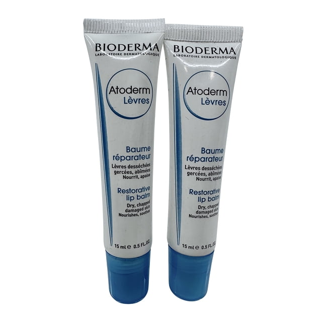 Bioderma Baume à Lèvres Réparateur 0,5 OZ, Ensemble de 2, Comprenant Deux tubes de Baume à Lèvres Unisexe Conçu pour la Peau Sèche, Gercée et Abîmée. Chaque tube Contient 0,5 OZ (15 ml) de Baume en Forme de Crème Enrichi d'Huile d'Avocat, d'Extrait de laminaria, de Beurre de Karité et d'Acide Citrique. les tubes Sont Blancs avec des accents Bleus et Mettent en Valeur la Marque Bioderma et les Détails du Produit. Idéal pour Offrir