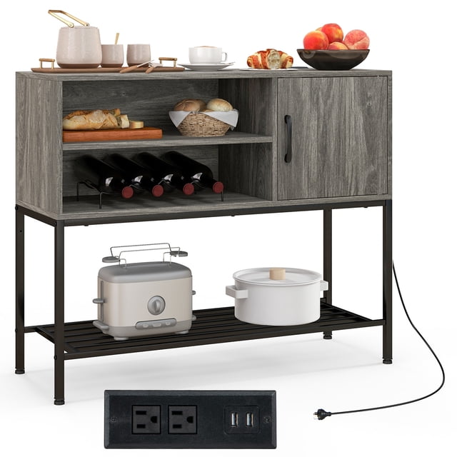 Gymax Buffet Sideboard with Power Outlets and USB Ports in rustic grey and black finish. Industrial-style sideboard features wine racks for 4 bottles, open storage shelves, and a cabinet with a magnetic door catch. Includes a bottom metal shelf for additional storage and a sturdy metal frame with adjustable foot pads. Designed with cable management and anti-toppling devices for safety. Functions as a charging station and is suitable for kitchens, dining rooms, or living spaces.