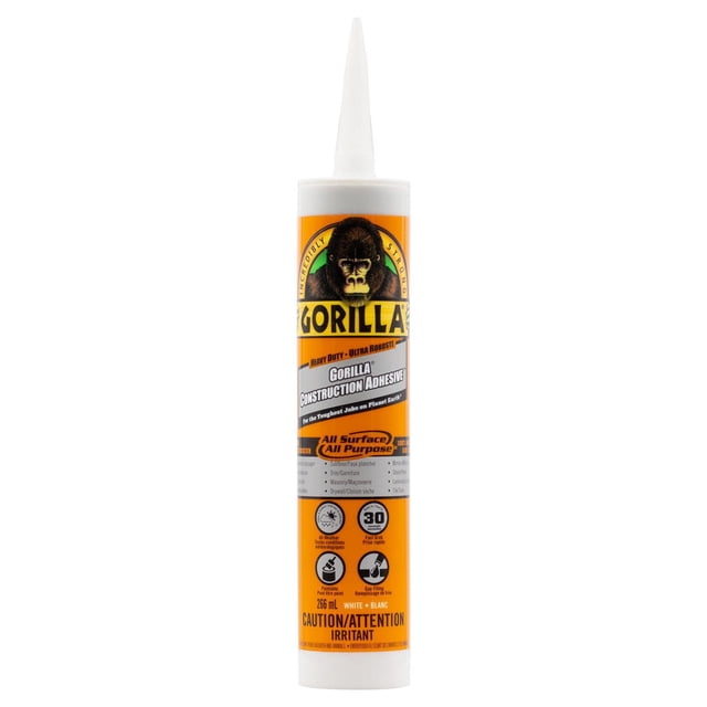 Construction Adhesive Gorilla heavy duty tube with orange and white label featuring gorilla logo, 266 ml size, all surface and all purpose formula with fast grab, gap filling, and all weather resistance, suitable for subfloor, drywall, trim, masonry, and tile adhesive applications.