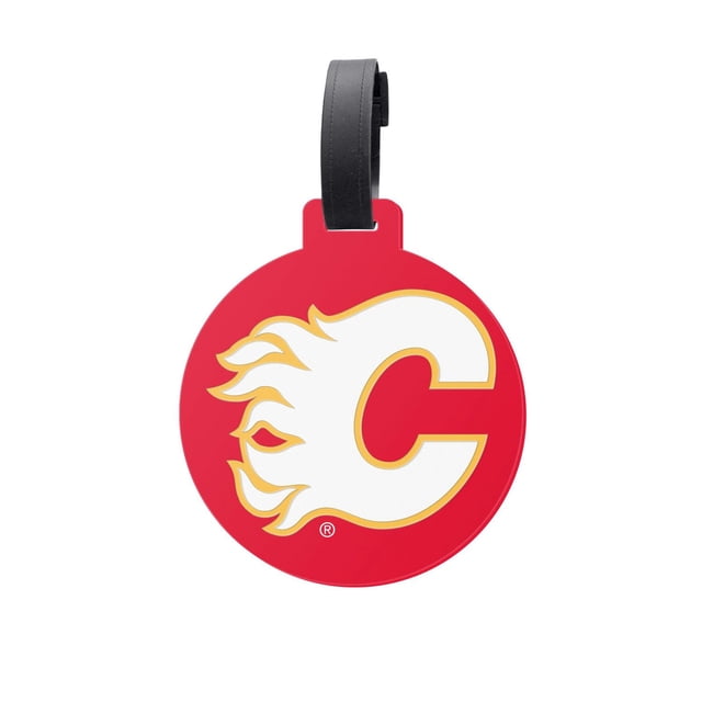 OFFICIALLY LICENSED NHL JUMBO BAG TAG CALGARY FLAMES is a 4.5-inch round red PVC tag with the Calgary Flames white and yellow flaming C logo, attached to a flexible black silicone strap, suitable for luggage, backpacks, or sports bags.