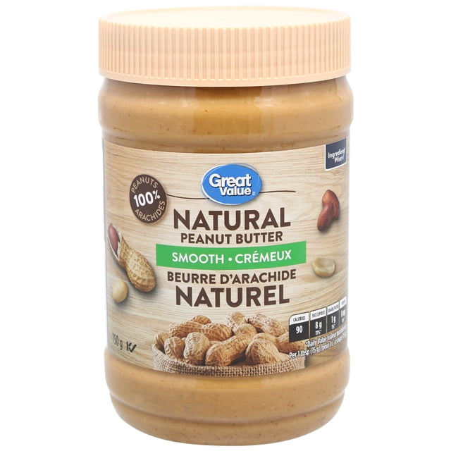 Great Value Smooth Natural Peanut Butter in a 750 g clear plastic jar with a beige ribbed lid, featuring bilingual English and French labeling, 100% peanuts claim, and an image of peanuts on a wood-textured background, ideal for spreading and cooking.