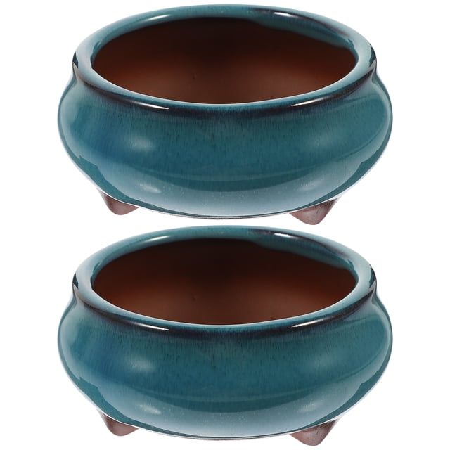 2pcs Chinese Ceramic Planter with Drainage Hole Glazed Pot Succulent Plant Pot. The image shows two round, teal-glazed ceramic planters with a smooth finish. Each planter includes a drainage hole and a slightly raised base for optimal plant health. Designed in a creative Chinese style, these planters are perfect for succulents, cacti, or small flowers. Measuring approximately 8.00x8.00x4.50cm (3.14x3.14x1.77in), they are suitable for home or office decoration.