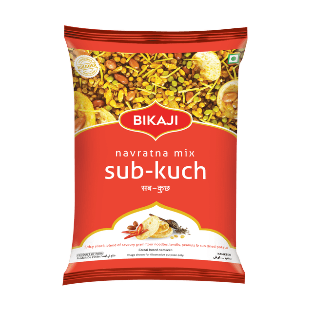 Bikaji Navratna Mix Sub-Kuch 140g snack pack with red-orange packaging displaying a blend of savory gram flour noodles, lentils, peanuts, and sun-dried potato, offering a crunchy, sweet, salty, and mildly spicy Indian cereal-based namkeen ideal for teatime or sharing.